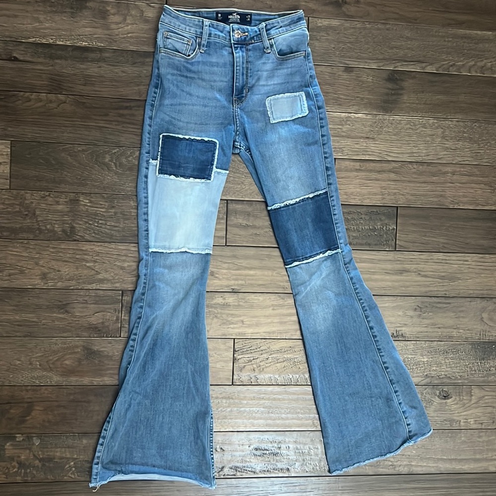 Hollister blue patchwork flare jeans. Size: W25 and L31.